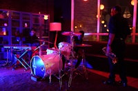 a group of people playing music in a room